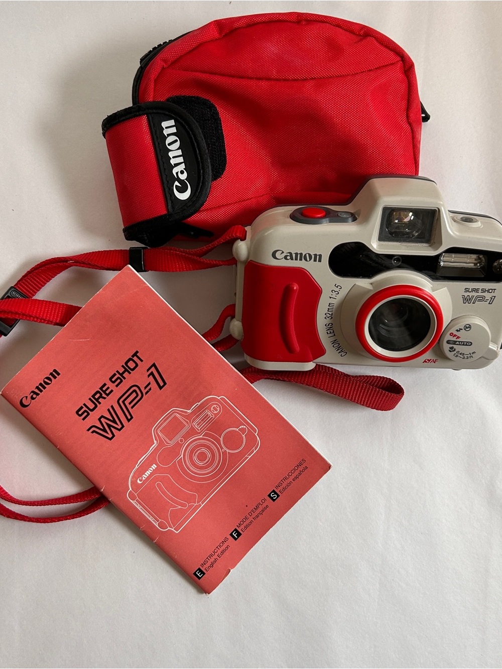 Canon Red and White Point-and-Shoot Film Camera with Red Case